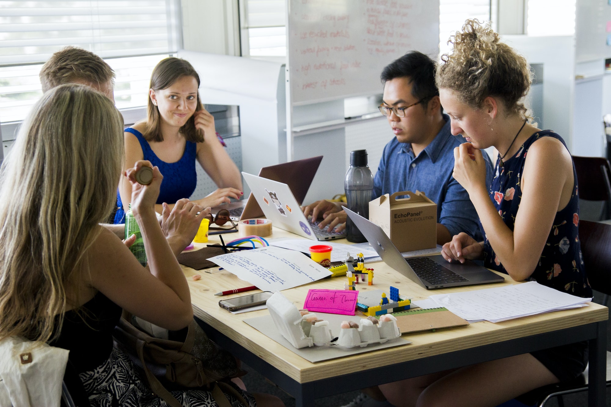 staff sits around conference table